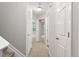 Bright hallway with natural light features access to multiple rooms and carpet flooring leading up the stairs at 330 Gilman Ln # 109, Raleigh, NC 27610