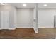 Open floor plan with hardwood floors and connecting spaces for the kitchen and living area at 330 Gilman Ln # 109, Raleigh, NC 27610