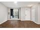 Unfurnished living room showcasing hardwood floors and lots of natural light at 330 Gilman Ln # 109, Raleigh, NC 27610