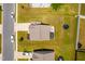 Aerial view of a home with backyard featuring a patio, solar panels and trampoline on a manicured lawn at 341 Henry Steel Dr, Gibsonville, NC 27249