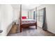 Cozy bedroom with a four-poster bed, neutral decor, and carpet flooring, offering a tranquil retreat at 341 Henry Steel Dr, Gibsonville, NC 27249