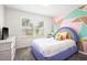Bright bedroom with colorful wall decor, comfortable bed, and natural light, creating a cheerful atmosphere at 341 Henry Steel Dr, Gibsonville, NC 27249