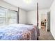 Comfortable bedroom with a four-poster bed, neutral decor and large windows, offering a tranquil retreat at 341 Henry Steel Dr, Gibsonville, NC 27249