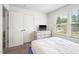 Bright bedroom with a dresser, TV, and natural light, offering a comfortable and functional space at 341 Henry Steel Dr, Gibsonville, NC 27249