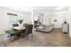 Dining area with modern furniture, a stylish chandelier, and a glimpse into the living room at 341 Henry Steel Dr, Gibsonville, NC 27249