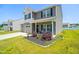 Beautiful home with a well-maintained lawn, two-car garage, and covered front porch at 341 Henry Steel Dr, Gibsonville, NC 27249