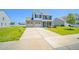 Charming two-story home featuring a two-car garage, well-manicured lawn, and inviting front porch at 341 Henry Steel Dr, Gibsonville, NC 27249