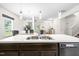 A lovely kitchen featuring dark cabinets, stainless appliances, and a center island with a double sink at 341 Henry Steel Dr, Gibsonville, NC 27249