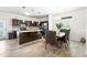 Modern kitchen with an island, stainless steel appliances, and stylish dining area at 341 Henry Steel Dr, Gibsonville, NC 27249