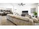Spacious living room with modern decor, hardwood floors, and an open floor plan at 341 Henry Steel Dr, Gibsonville, NC 27249