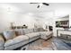 Comfortable living room with modern decor, hardwood floors, and an area rug at 341 Henry Steel Dr, Gibsonville, NC 27249