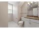 A quaint bathroom featuring a marble counter, tile floor and great lighting at 3705 Old Post Rd, Raleigh, NC 27612