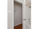 A bathroom with a white tiled tub/shower and wooden floors just outside the door at 3705 Old Post Rd, Raleigh, NC 27612