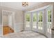 Sunlit breakfast nook with tile floors and access to the outdoor deck at 3705 Old Post Rd, Raleigh, NC 27612