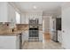 Well-equipped kitchen with stainless steel appliances and granite countertops at 3705 Old Post Rd, Raleigh, NC 27612