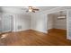 Open living room featuring hardwood floors and access to the dining room at 3705 Old Post Rd, Raleigh, NC 27612