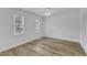 Bright bedroom with hardwood flooring, natural lighting, fan and spacious closet space at 410 Oak Run Dr, Raleigh, NC 27606