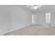 Neutral bedroom with carpet, a ceiling fan, and ensuite bathroom entrance at 410 Oak Run Dr, Raleigh, NC 27606