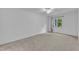 Bright bedroom with neutral carpet, ceiling fan, and natural light from the window at 410 Oak Run Dr, Raleigh, NC 27606