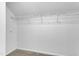 Empty walk-in closet featuring carpeting and wire shelving, offering ample storage space at 410 Oak Run Dr, Raleigh, NC 27606