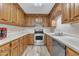 Traditional kitchen featuring wood cabinets, stainless steel appliances, and light countertops at 410 Oak Run Dr, Raleigh, NC 27606