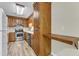 The kitchen is equipped with stainless steel appliances and wood cabinets at 410 Oak Run Dr, Raleigh, NC 27606