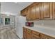 Spacious kitchen with wooden cabinets, and stainless appliances adjacent to a bright dining area at 410 Oak Run Dr, Raleigh, NC 27606