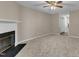 Spacious living room with a fireplace and neutral carpet flooring and open layout at 410 Oak Run Dr, Raleigh, NC 27606