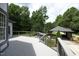 Back deck with gray wood and black railings overlooks a well-kept yard at 4217 Grahamstone Rd, Raleigh, NC 27610