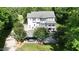 Aerial view of backyard featuring a covered patio and manicured lawn at 4217 Grahamstone Rd, Raleigh, NC 27610