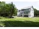 A view of the backyard with a covered patio and plenty of trees at 4217 Grahamstone Rd, Raleigh, NC 27610