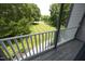 Balcony view with green lawn and trees at 4217 Grahamstone Rd, Raleigh, NC 27610