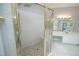 Bathroom featuring a tiled shower with glass doors and a vanity with a mirror at 4217 Grahamstone Rd, Raleigh, NC 27610