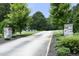 A long driveway with stone pillars leading to the house at 4217 Grahamstone Rd, Raleigh, NC 27610