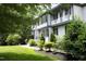 A view of the house with a beautiful lawn and landscaping at 4217 Grahamstone Rd, Raleigh, NC 27610