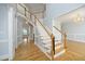 Elegant foyer with a grand staircase, hardwood floors, and bright, neutral paint, offering a welcoming entrance at 4217 Grahamstone Rd, Raleigh, NC 27610
