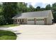 Spacious detached garage with multiple bays, ideal for car enthusiasts or extra storage, with a long driveway at 4217 Grahamstone Rd, Raleigh, NC 27610