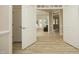 Bright and airy interior view showcases an open floor plan and wood-look floors at 4217 Grahamstone Rd, Raleigh, NC 27610
