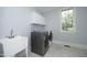 Laundry room with washer, dryer, and sink at 4217 Grahamstone Rd, Raleigh, NC 27610