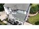The back of the home with an elevated deck and a covered porch at 4217 Grahamstone Rd, Raleigh, NC 27610