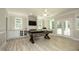 Bright recreation room features neutral walls, a ceiling fan, and a pool table at 4217 Grahamstone Rd, Raleigh, NC 27610