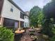 Expansive backyard patio with multiple seating areas, perfect for outdoor dining and relaxation at 502 Willowmere Ct, Cary, NC 27513