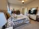 Cozy bedroom featuring a comfy bed, storage shelves and lots of natural light at 502 Willowmere Ct, Cary, NC 27513