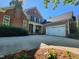 Beautiful brick home with a spacious driveway and attached two-car garage at 502 Willowmere Ct, Cary, NC 27513