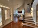 Foyer with stairs leading to the second story and entry into the living room at 502 Willowmere Ct, Cary, NC 27513