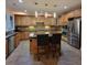 Updated kitchen with stainless steel appliances, center island, and ample cabinet space at 502 Willowmere Ct, Cary, NC 27513