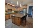 Kitchen featuring granite countertops, a center island with seating, and stainless steel appliances at 502 Willowmere Ct, Cary, NC 27513