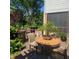 Outdoor dining area with a built-in grill, perfect for enjoying meals in the landscaped backyard at 502 Willowmere Ct, Cary, NC 27513