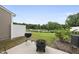 Backyard features a grill, fire pit, grassy area, and a fence line at 511 Kenton Mill Ct, Rolesville, NC 27571
