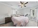 Bedroom with a ceiling fan, wall decor, exercise bike, and natural light at 511 Kenton Mill Ct, Rolesville, NC 27571